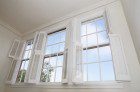 a picture of white open Window Shutters