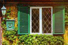 a picture of green Outdoor Window Shutters in Sydney